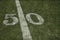 Friday Night Lights Football Game on Football field fifty yard line background