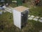 Fridge in a messy backyard