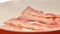 fried bacon.Bacon strips fry in frying pan.Breakfast preparation.