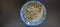 Fried bean sprouts in a plate on a black wooden table