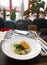 Fried black cod fillet on restaurant table
