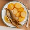 Fried blue whiting fish with potato