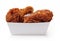 Fried breaded chicken in white cardboard box