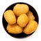 Fried breaded chilli cheese nuggets in a black ceramic bowl isolated on white from above