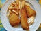 Fried breaded hake fillet with french fries