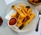 Fried calcots in tempura with romesco sauce