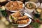 Fried carp with sauerkraut and puff pastry pies filled with mushrooms for Christmas Eve supper in Poland