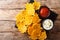 Fried cheddar cheese chips with herbs served with sauces close-up. Horizontal top view