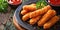 Fried cheese sticks with seasoning on dark wooden board