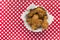 Fried Chicken basket on red and white checkered table