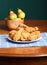 Fried Chicken on Blue Placemat and Bowl of Pears