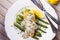 Fried chicken breast on asparagus with tarragon and mushroom sauce. View from above, top studio shot