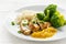 Fried chicken breast fillet with fruity mango sauce, broccoli an
