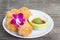 Fried chicken and decorative orchid