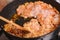 Fried chicken forcemeat on frying pan