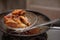 Fried chicken in hot oil and boiling in pan