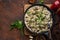 Fried chicken liver with creame sauce on black cast iron pan