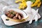 Fried chicken liver with pork rind breading in a yellow cast iron baking dish