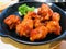 Fried chicken mixed with Korean style sauce.