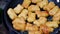 Fried chicken nuggets in the pan with hot oil.