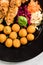 Fried chicken with potato balls and salad, restaurant serving portion