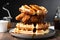 fried chicken and waffle stack, with syrup drizzled over the top