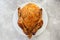 Fried chicken on a white plate. Slow cooking, farm, recipe