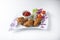 Fried chicken wings on a decorated plate and white background