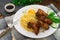 Fried chicken wings with spaghetti. Wooden background. Close-up. Top view