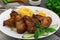 Fried chicken wings with spaghetti. Wooden background. Close-up. Top view