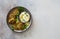 Fried chickpeas falafel patties and yogurt sauce on gray stone background