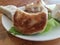 Fried Chinese dumplings or potstickers on plate with lettuce