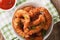 Fried coconut shrimp closeup and tomato sauce. horizontal top vi
