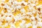 Fried corn. Fresh white popcorn. Yellow bright background