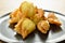 Fried crispy Chinese dumpling paste wrapped egg quail on plate