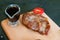 Fried, delicious steak of veal, beef or pork, tomato, rosemary on wooden board, close-up