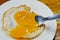 Fried egg with creamy yolk while fork stab