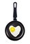 Fried egg heart shape in a pan