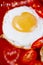 Fried egg with heart shape yolks and heart shaped bokeh