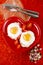 Fried egg with heart shape yolks and rose tea