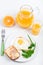 Fried egg and a jug of orange juice