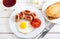 Fried egg, mini sausages, tomato