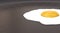 Fried egg in pan close-up