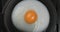 Fried egg on a pig-iron frying pan preparation process