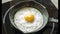 Fried egg on a pig-iron frying pan preparation process time lapse