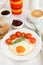 Fried egg on the plate with bread, juice