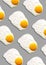 Fried egg or scrambled eggs pattern on grey background. Creative food concept. Top view. Conceptual trend. Banner. Keto diet.