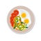 Fried egg and sliced vegetables on a plate, isolated on a white background