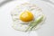 Fried egg sunny side up with chive