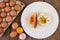 Fried egg on a white plate with toast, sliced â€‹â€‹Spring onion and sliced â€‹â€‹tomatoes